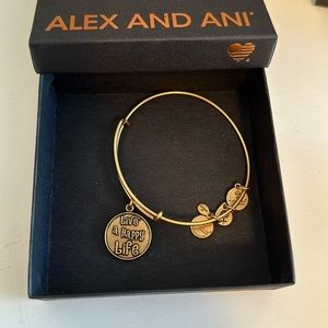 Alex and Ani gold bracelet. “Live a happy life”